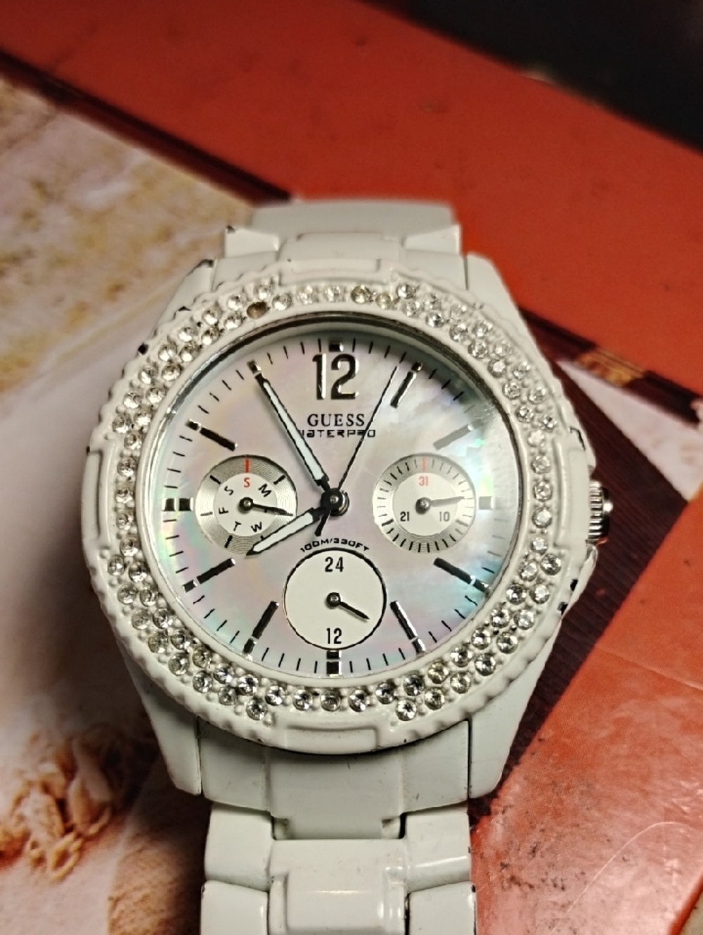 Guess Women's White Crystal Accent Watch with Mother-of-Pearl Dial